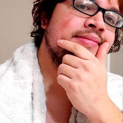 Awkward Pose of Man with Glasses and Beard