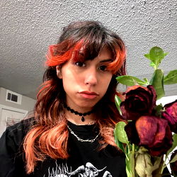 Eris, a young model from Texas, holding red roses.