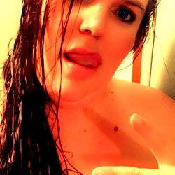 A Baby Model Showing Wet Hair and Making a Peace Sign