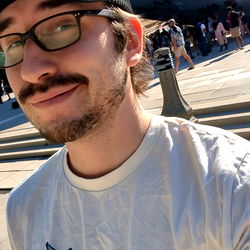 A Man Taking a Selfie at the Sculpture Park