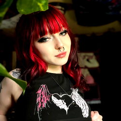 Sinful, a tattooed adult model with piercing