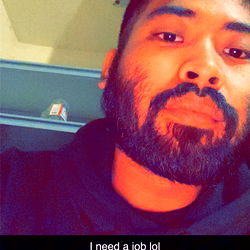 A Man with a Beard in a Black Hoodie