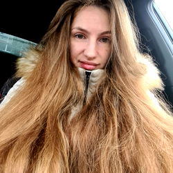 A Girl with Long Hair and a Fur Coat