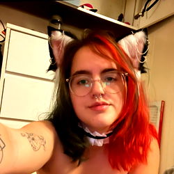 Athena, A Vibrant Feline with Red and Black Fur and Ears, Poses for a Selfie