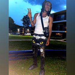 Young Male Rapping in Front of Building