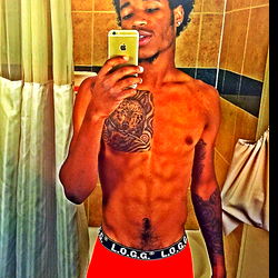 Fitness-Focused Young Man in Bathrobe and Tattoos