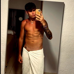 Fitness Model Showcasing Physique in Hotel Bathroom