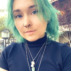 Corvus, the Tattooed Cat-Lover, Strikes a Pose with Cosmic Vibes