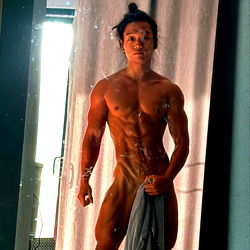 Asian Tarzan: The OnlyFans Model Standing Nearby