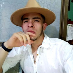 Model in Cowboy Hat Posing for Photograph