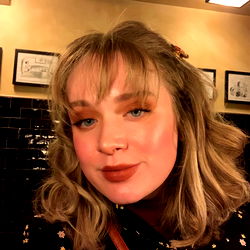 Gabby, a young woman with striking features and fashionable style