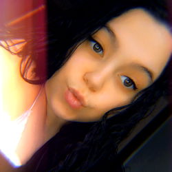 Photo of Alexissss, a young woman with short hair.