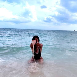 Alita Angel in a Swimsuit on the Beach