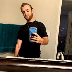 Fun-Loving Guy Taking a Selfie in the Bathroom