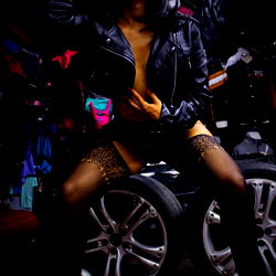 Andrea Colin: Erotic Model in Leather and Fishnet Lingerie