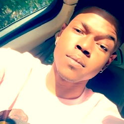 A Young Adult Male in a Car, Taking a Selfie