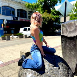 Angel Daze Sitting on a Sculpture