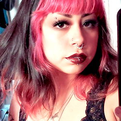 Naoms, a talented OnlyFans model with striking features