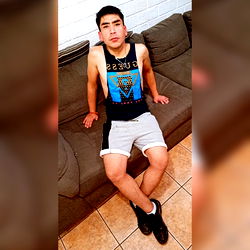 Man in Tank Top Sitting on Couch