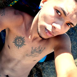 Casual pose on rocky beach