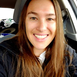 Smiling Woman with Brown Hair in Car