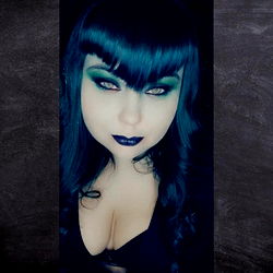 Angelica Dred, an OnlyFans model with dark hair and blue eyes.