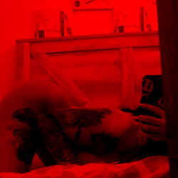 Red and Black Artwork of Model KARMA♏️👅 in OnlyFans