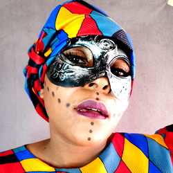 Vibrant, Afrocentric Masked Model in Colorful Costume