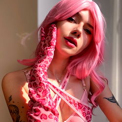 Vibrant and Stylish Model in a Pink Leopard Outfit with Purple Glove