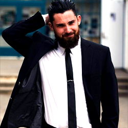 Fashionable Mr. Charles Standing Outdoors in a Suit