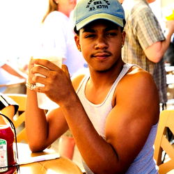 Casually Dressed Man with Mustache at a Table