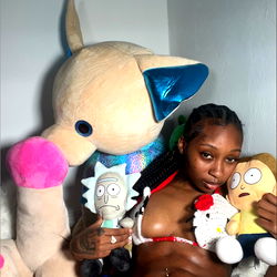 Ritaa Bang, a Florida-based OnlyFans model, in festive attire with plushies and toys.