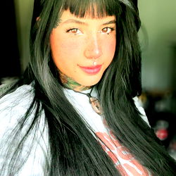 Ava Bunny, a striking model with long hair and tattoo. A true embodiment of modern beauty.