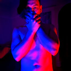Model with Unique Pose in Blue and Purple Light