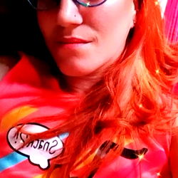 A vibrant and playful portrait of Lady Orange, a model known for her striking red hair.