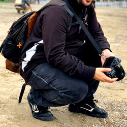 Akita, a photographer in a casual pose