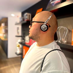 A Man in Headphones, Listening to Music