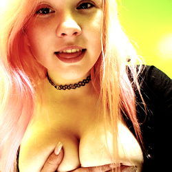 OnlyFans Model Showcasing Breasts in Shirtless Selfie