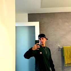 IMPDOG in the mirror with a phone, LA based model