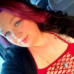 Stylish OnlyFans Model Nikkibaby Taking a Selfie with Red Hair