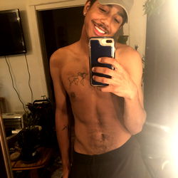 A Cheeky and Tattooed Model Sharing a Playful Moment