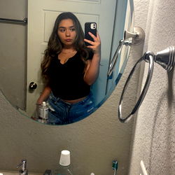 A Model in a Bathroom Mirror