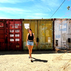 Casual Stroll in Front of Shipping Containers