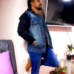 Man in Jean Jacket Standing