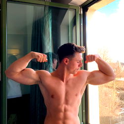 Fit and Muscular Model Andrex Mzq Posing for a Mirror Selfie