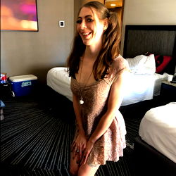 Abigail Thorn in Roll Tide, Striking a Pose in a Chic Dress