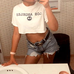 Trendy Instagram Model in Bathroom Mirror