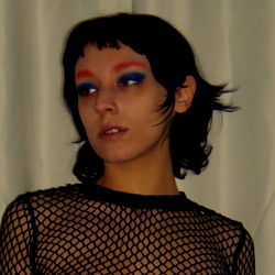 Onlyfans Model Baby_E with a Striking Pink Eye Shadow and Blue Hair,