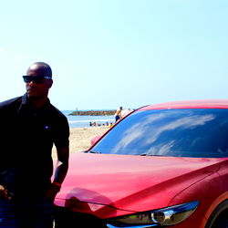 Andrés David Mesu on a Beach with the Bmw 8 Series Gran Coupe