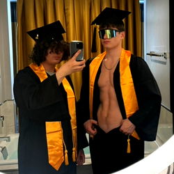 Two Graduates in Yellow Robes